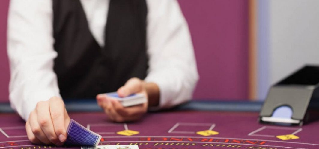 dealer-dealing-cards-casino-855x458